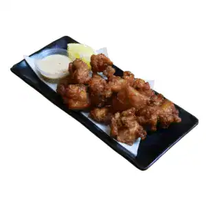Japanese karaage fried chicken pieces with lemon and sesame dipping sauce