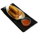 Three golden-brown vegetable spring rolls served with Thai chili dipping sauce